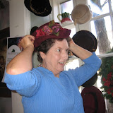 Dan's mom tries on fancy hats at the tea room, January 2010