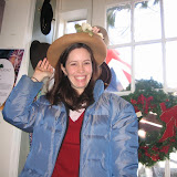 Katie tries on hats at the tea room, January 2010