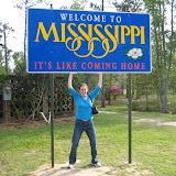 Katie holds up the Mississippi sign -- sort of.