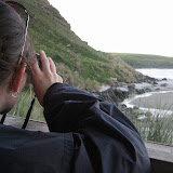 Katie getting a closer look of the penguins with her binoculars