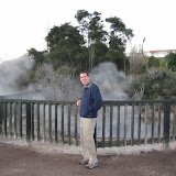 Dan poses in front of one of the steaming pools