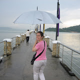 Katie dodges the rain on our way to Jerejak Island.
