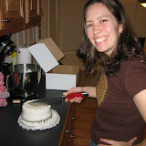 Katie gets ready to cut the cake for the 1 year anniversary.