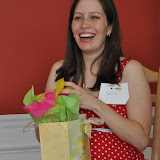 Katie opens presents at the baby shower