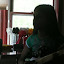 Nadia playing Wii Guitar Hero