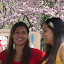 Devi and Amelia under the cherry tree bloom