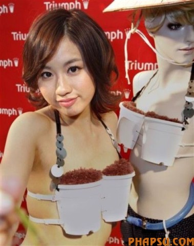 Model Reiko Aoyama displays a Triumph bra with a theme on the growing popularity of farming in Japan during an unveiling in Tokyo on Wednesday, May 12, 2010.  Called "Grow-Your-Own-Rice Bra," the new underwear  transforms into a pot that can grow rice. It was created and introduced by the lingerie manufacturer Triumph International Japan Ltd.  It's not for sale, however. (AP Photo/Shizuo Kambayashi)