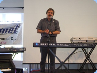 The owner of the Music Planet Group of music stores, Roger Smith, welcoming the audience to the Musical Extravaganza.