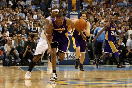 DENVER - MAY 23: Trevor Ariza #3 of the Los Angeles Lakers is fouled by Carmelo Anthony #15 of the Denver Nuggets after Ariza stole the ball late in the fourth quarter in Game Three of the Western Conference Finals during the 2009 NBA Playoffs at Staples Center on May 23, 2009 in Denver, Colorado. NOTE TO USER: User expressly acknowledges and agrees that, by downloading and or using this photograph, User is consenting to the terms and conditions of the Getty Images License Agreement. (Photo by Jed Jacobsohn/Getty Images)