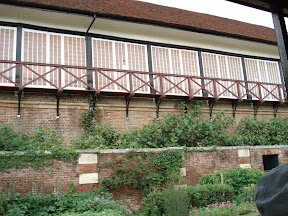 The outside of the oldest tennis court in the world.  These guys were playing tennis inside too