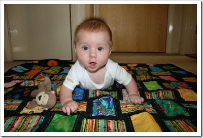 Harper and Monkey on quilt