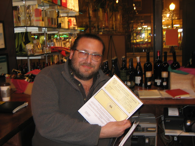 Mitch proudly holds West Town license