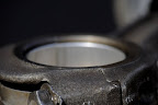 Piston arm with bearing.