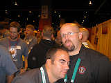 Mike loves Tomme. (Damn there's a lot of people in our booth.)