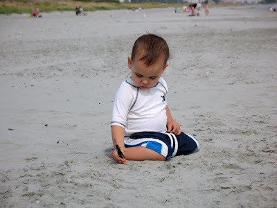 Gabriel examines a feather
