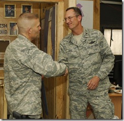 090624-F-0465C-003 Col Kwast Congratulating Col Reed