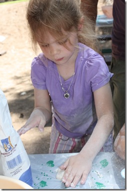 Abigail rolling out the pita