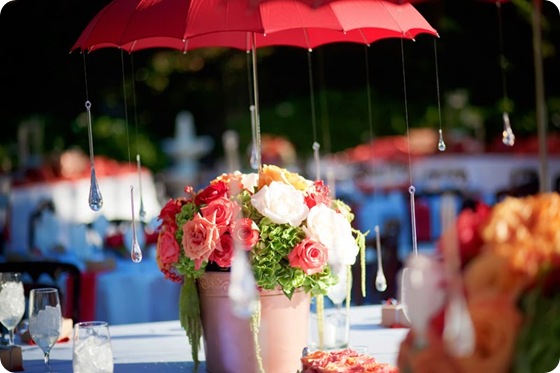 whimsical umbrella centerpiece roses hydrangea pink red green