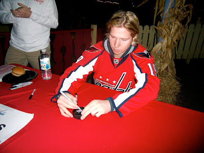 Nick is signing my puck!