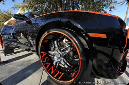 A custom 2010 Chevrolet Camaro with a widebody kit and Asanti rims is on