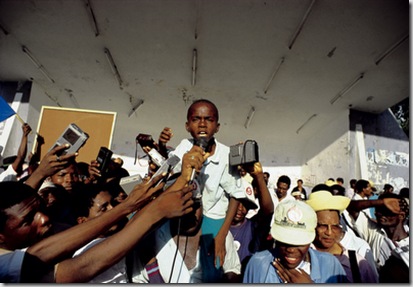 © Marc French / Panos Pictures

HAITI. 1990.

Aristide orphan taking the chance to harangue the media at an election rally for Jean-Bertrand Aristide, who was to become President.