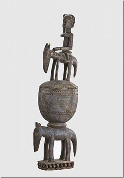 Figures are stacked up on one another in this medicine bowl by an unknown Dogon artist from Mali. The 29th century wood carving is in the permanent collection of the Bowers Museum.