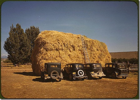 Hay stack and automobile of peach pickers. Delta County, Colorado, 1940. Reproduction from color slide. Photo by Russell Lee. Prints and Photographs Division, Library of Congress