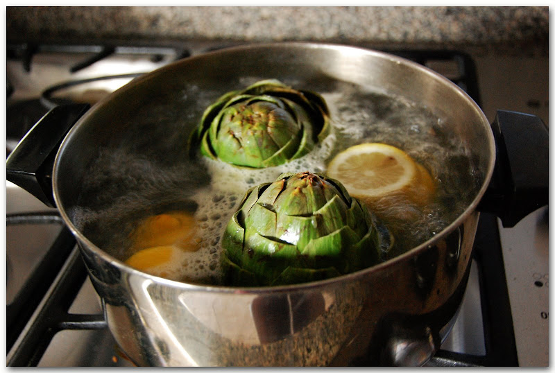 Artichokes boiling in water