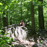 holly hiding behind a rock