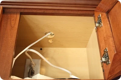 hole in cabinet for lights