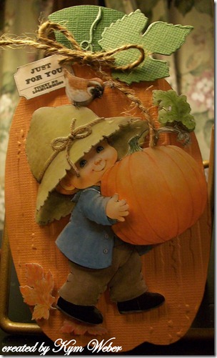 Little Boy Holding a Pumpkin