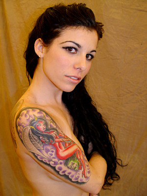 Woman Tattoos at Pretty Woman Arm