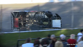 #52 Mark Gordon sliding down the front-stretch in heat race wreck