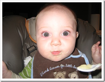 Big-eyed baby enjoying some applesauce, 9-30-09