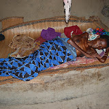  &ndash; Lying only on a grass mat...no sterile hospital bed with meds to make her comfortable, this lady is surrounded by her family and friends, in fully aware of all around her. .....Dec. 2, 2007…. © 2007 NHA Photos