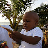  &ndash; Roo holding a fish that Lucy and Ann Marie brought him from the ocean at Lumley Beach…. © 2007 NHA Photos