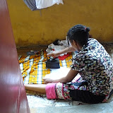  &ndash; Kadijah irons clothes with the charcoal heated iron…. © 2007 NHA Photos