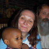  &ndash; Roo playing with vicki's hair as he tries to snuggle to sleep…. © 2008 NHA Photos, James Mansaray: Photographer