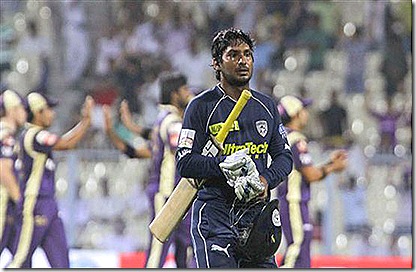 Deccan Chargers' captain Kumar Sangakkara walks back to the pavilion after his dismissal during the Indian Premier League cricket match against Kolkata Knight-2011-
