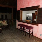 Le Phare Bleu: Veranda mit Bar, direkter Zugang zur Küche