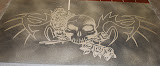 decortative_concrete_stain_skull_logo_engraving.jpg