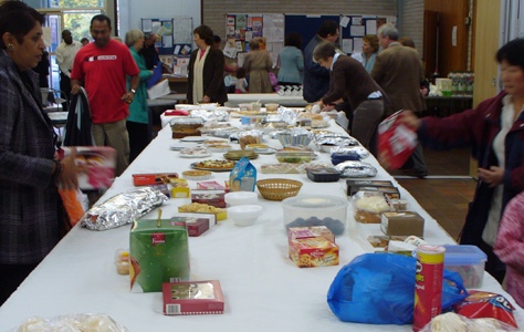 Preparations for the bring and share lunch after Mass.