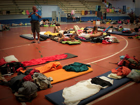 makeshift beds in a sports hall