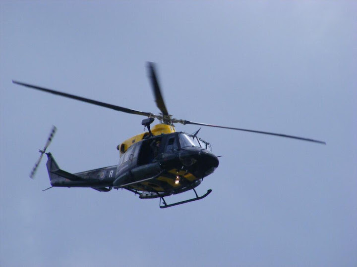 Helicopter A helicopter appeared while we were descending Cnicht and the friendly guy waved at us. None of us dared wave back lest we be mistaken for hikers in distress