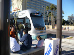  &ndash; another view of the train at the station, people sitting around