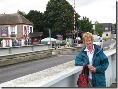 Sylvia with cafe in background.