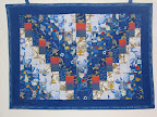 Reveal Your Hidden Light! This Hanukah piece contains a menorah that isn't obvious close-up, but is readily apparent as the view backs up a bit. The back depicts donuts, a Hanukah treat. (Private Collection)