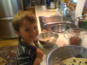 Happy Chef with blueberries, batter, and the special topping.