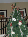 Rodney Reindeer sitting on top of the tree