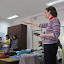 With some of her 9th graders, Lea Coppage instructs her students about an orderly debate.